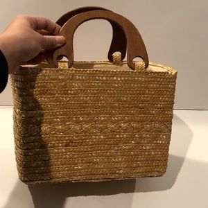Straw woven bag with wooden handles